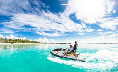 a couple on a jet ski in the water